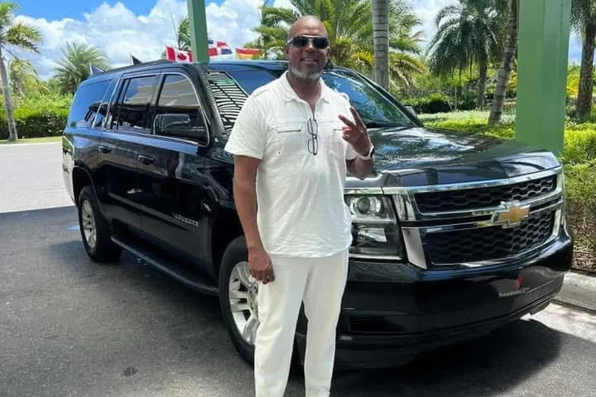 Jay Rodriguez providing private airport transportation service in Punta Cana with a black SUV