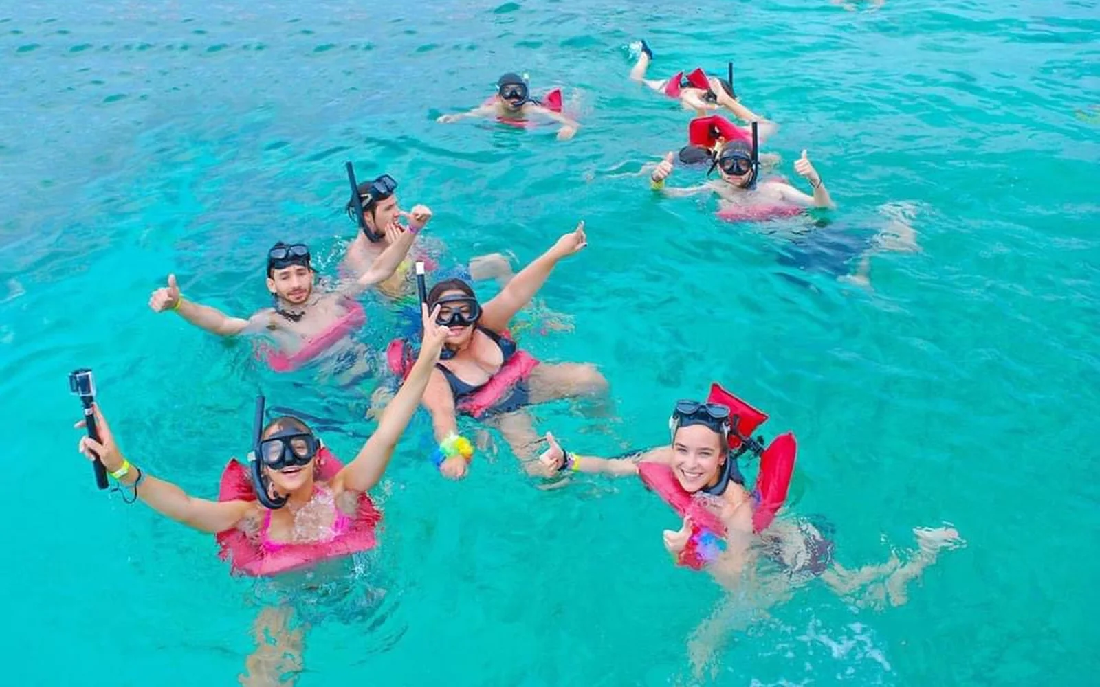 Snorkeling in clear Caribbean water during a private Saona Island catamaran excursion
