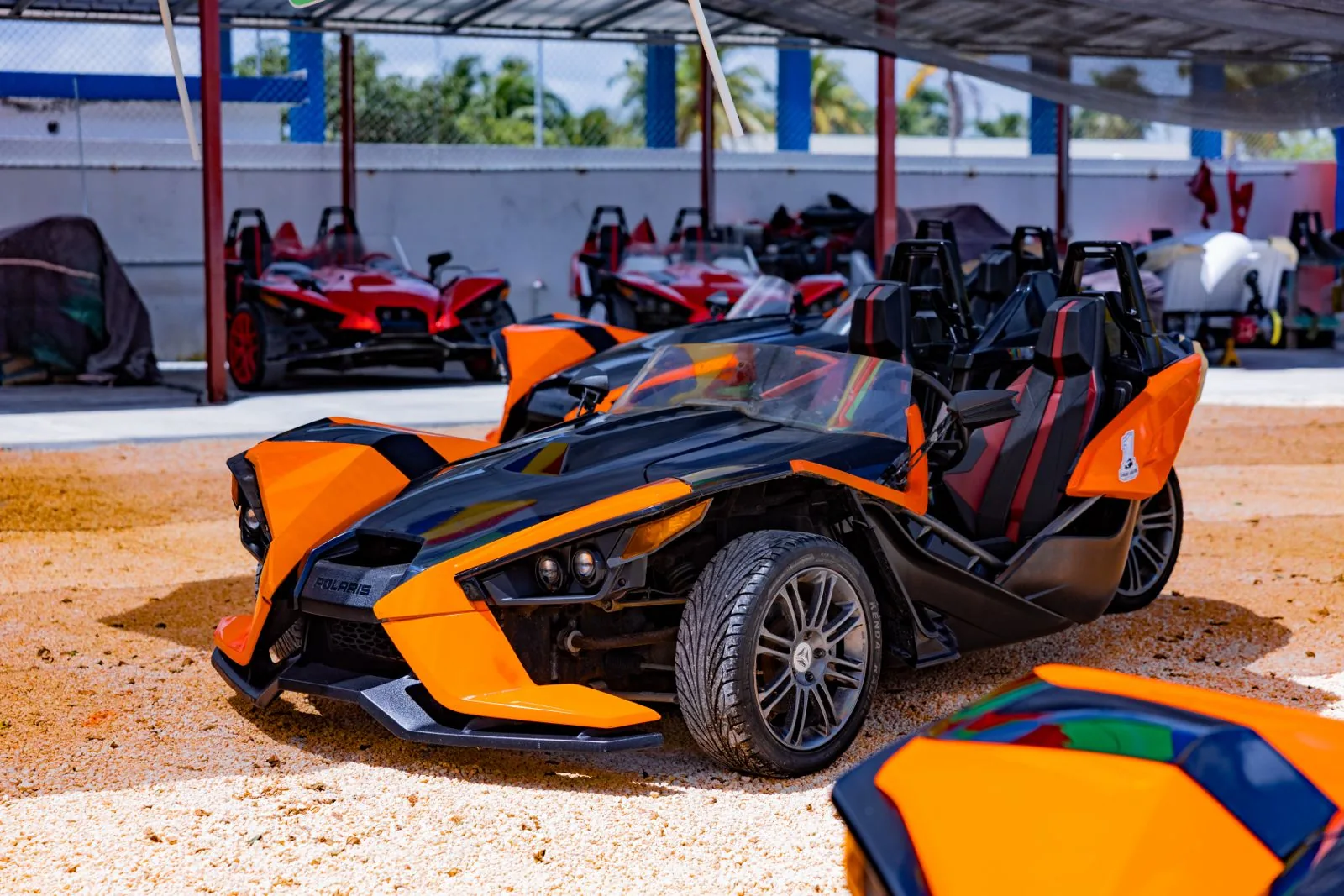Orange Polaris Slingshot ready for a guided Punta Cana countryside adventure