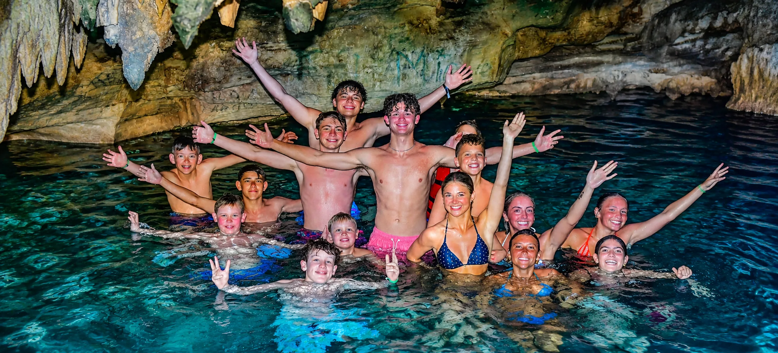 Group swimming inside a natural cave during Wild Trails Buggies excursion in Punta Cana