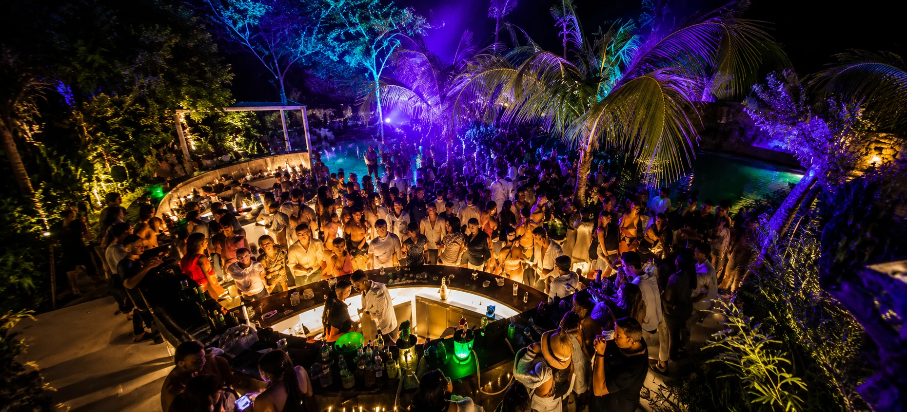 Guests dancing at a tropical cave disco party at Domitai Park in Punta Cana.