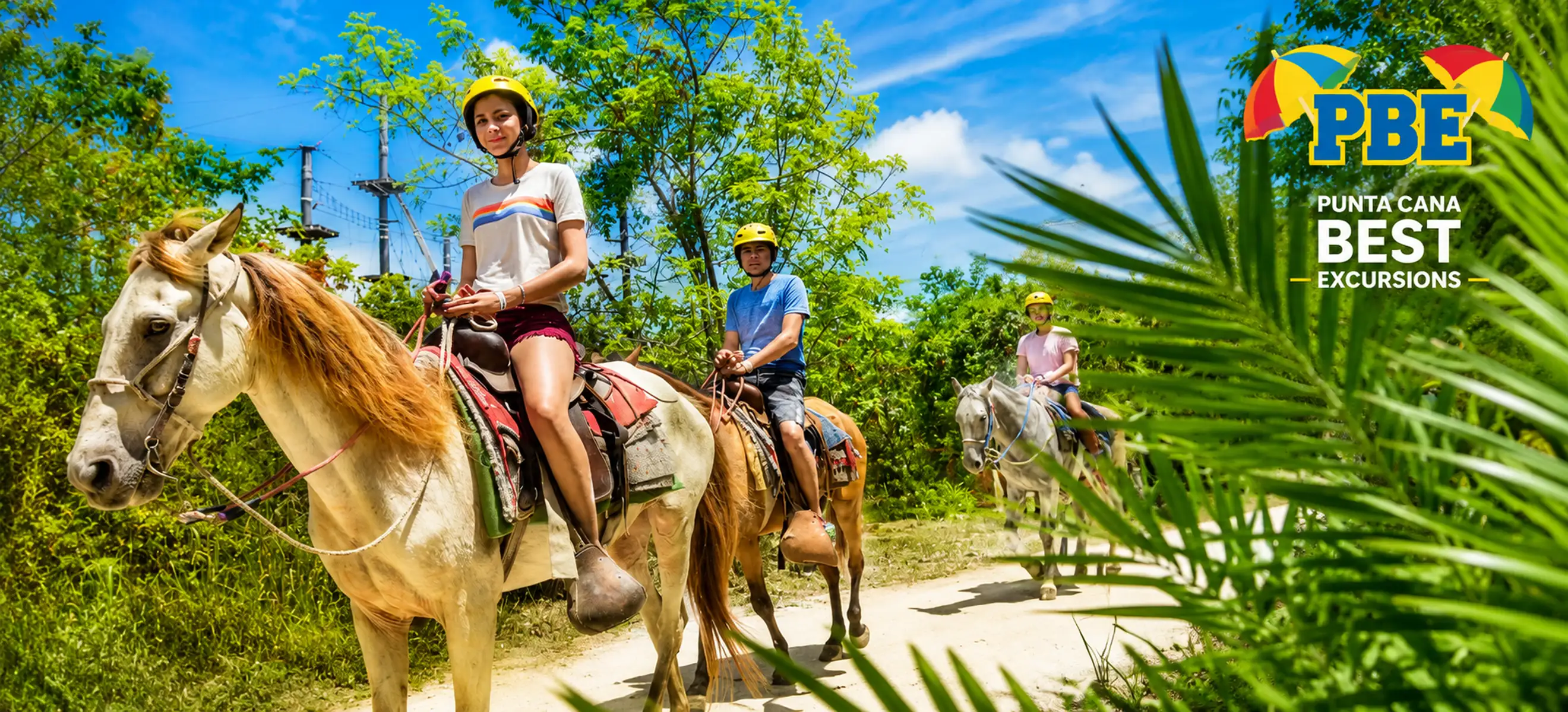 Guests horseback riding along a tropical jungle trail in Punta Cana.